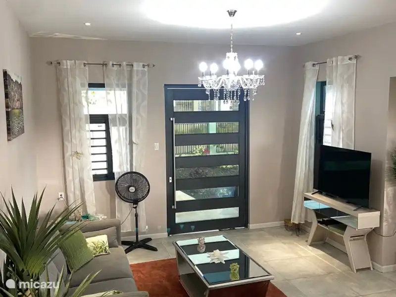 Open-plan living room and kitchen at Queen of the Hill Villa